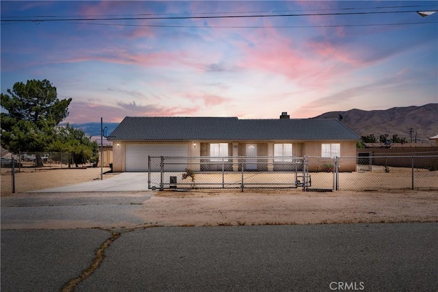 9275 Verdugo Ave, Hesperia, CA 92345 - ranch-style home with concrete driveway, stucco siding, a garage, and a chimney