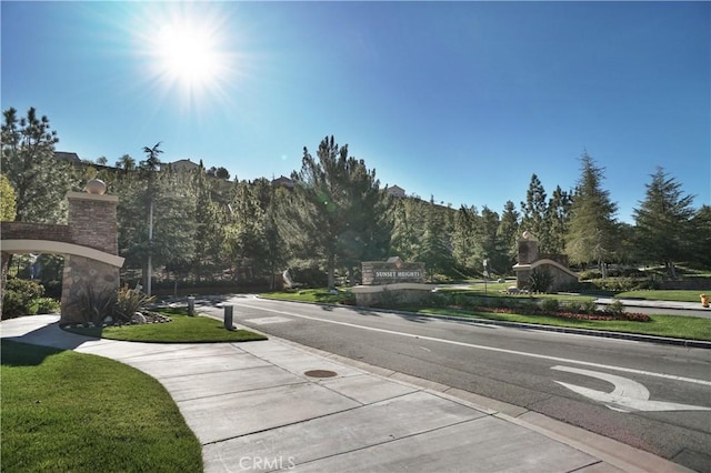 17334 Sierra Sunrise Ln, Canyon Country, CA 91387 - view of asphalt street with sidewalks and curbs