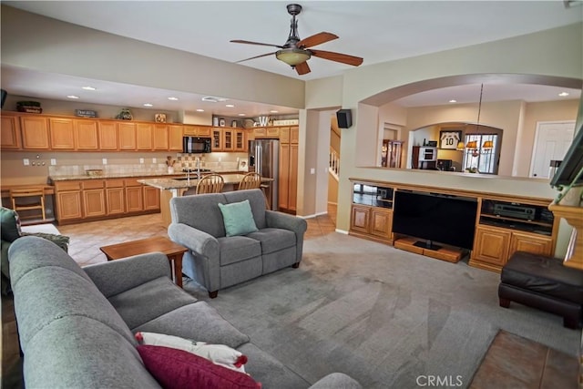17334 Sierra Sunrise Ln, Canyon Country, CA 91387 - living area featuring arched walkways, a ceiling fan, recessed lighting, and light colored carpet