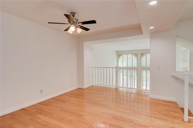 6052 Shadowbrook Cir, Huntington Beach, CA 92648 - unfurnished room featuring ceiling fan, recessed lighting, wood finished floors, and baseboards