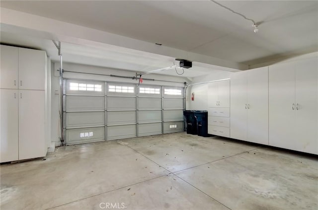 6052 Shadowbrook Cir, Huntington Beach, CA 92648 - garage with a garage door opener