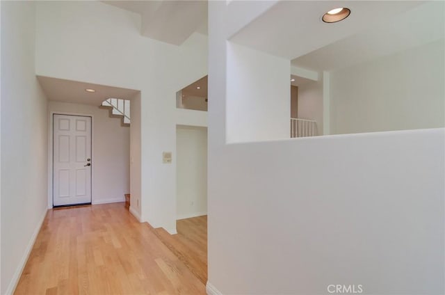 6052 Shadowbrook Cir, Huntington Beach, CA 92648 - hallway featuring light wood-style flooring, recessed lighting, and baseboards