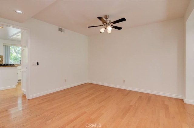 6052 Shadowbrook Cir, Huntington Beach, CA 92648 - unfurnished room featuring light wood-style floors, ceiling fan, recessed lighting, and baseboards