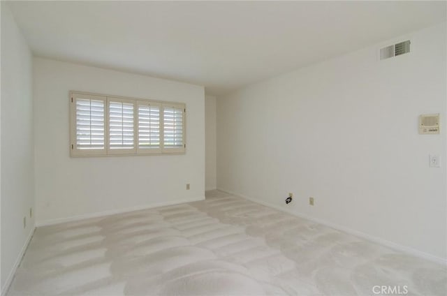 6052 Shadowbrook Cir, Huntington Beach, CA 92648 - spare room with light carpet and baseboards