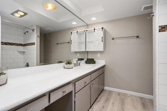 3404 Oak Cliff Dr Unit 2, Fallbrook, CA 92028 - bathroom with recessed lighting, vanity, wood finished floors, and baseboards
