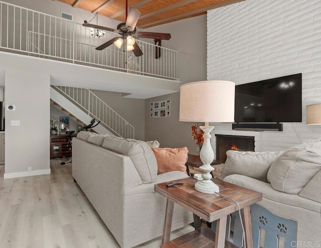 3404 Oak Cliff Dr Unit 2, Fallbrook, CA 92028 - living area featuring wood ceiling, ceiling fan, stairway, light wood-style flooring, and a towering ceiling
