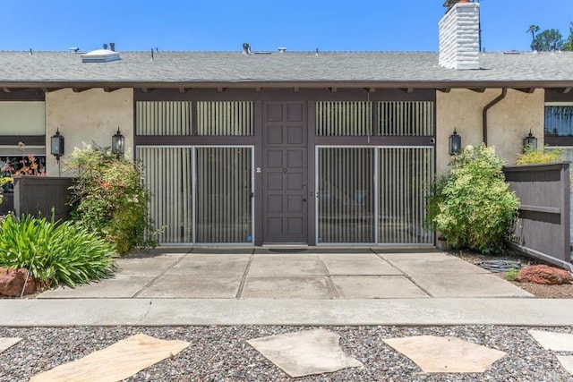 3404 Oak Cliff Dr Unit 2, Fallbrook, CA 92028 - rear view of property with stucco siding, a gate, a chimney, and a shingled roof