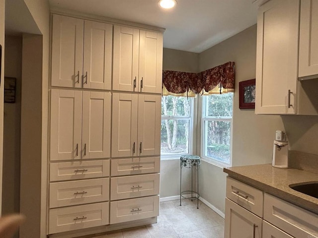 4349 Yale Ave, La Mesa, CA 91942 - kitchen with baseboards, white cabinetry, recessed lighting, and light tile patterned flooring