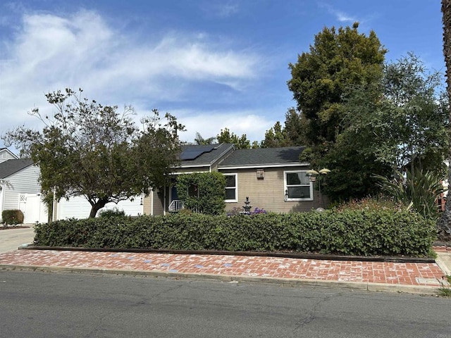 4349 Yale Ave, La Mesa, CA 91942 - view of front of house featuring roof mounted solar panels and an attached garage