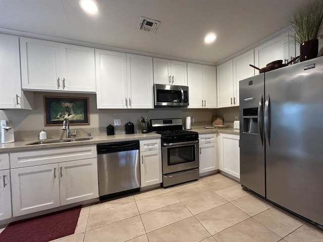 4349 Yale Ave, La Mesa, CA 91942 - kitchen with appliances with stainless steel finishes, a sink, light tile patterned floors, and recessed lighting