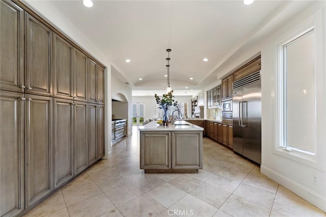 12 Via Avoria, Newport Coast, CA 92657 - kitchen with built in appliances, lofted ceiling, recessed lighting, a kitchen island with sink, and healthy amount of natural light