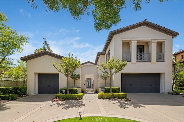 12 Via Avoria, Newport Coast, CA 92657 - view of front of house with concrete driveway and stucco siding