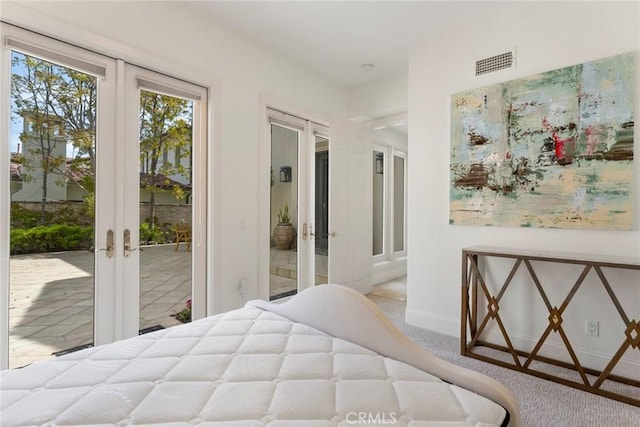 12 Via Avoria, Newport Coast, CA 92657 - carpeted bedroom with french doors, access to exterior, and baseboards