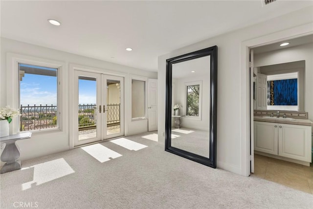 12 Via Avoria, Newport Coast, CA 92657 - interior space with light colored carpet, french doors, recessed lighting, baseboards, and a sink