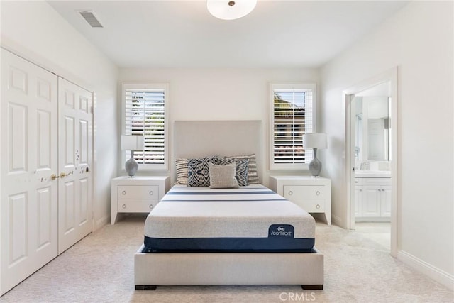 12 Via Avoria, Newport Coast, CA 92657 - bedroom featuring light colored carpet, multiple windows, a closet, and baseboards