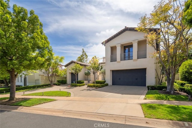 12 Via Avoria, Newport Coast, CA 92657 - greek revival inspired property with driveway, stucco siding, a garage, and a balcony