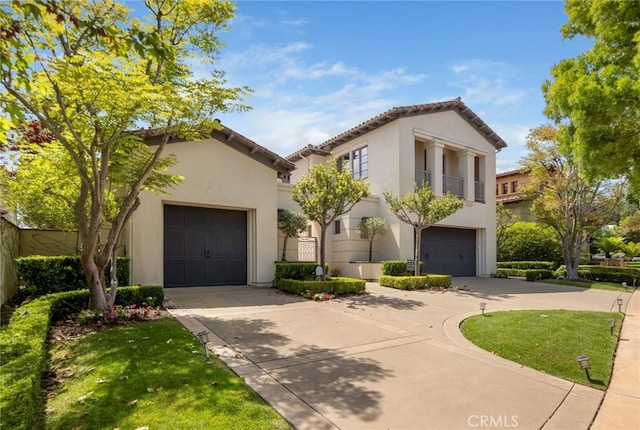 12 Via Avoria, Newport Coast, CA 92657 - view of front of property with concrete driveway, stucco siding, and a tile roof