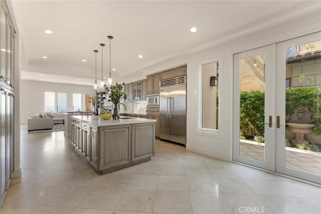12 Via Avoria, Newport Coast, CA 92657 - kitchen featuring built in appliances, a sink, open floor plan, recessed lighting, and french doors