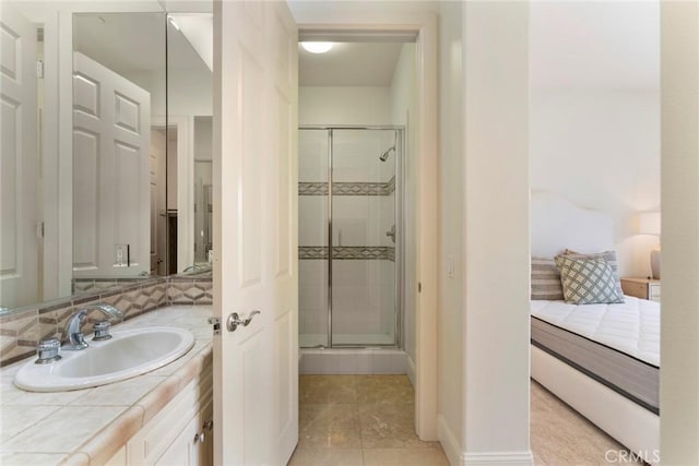 12 Via Avoria, Newport Coast, CA 92657 - bathroom featuring a shower stall, vanity, tile patterned flooring, and baseboards