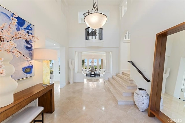 12 Via Avoria, Newport Coast, CA 92657 - entryway featuring decorative columns, stairs, and a towering ceiling