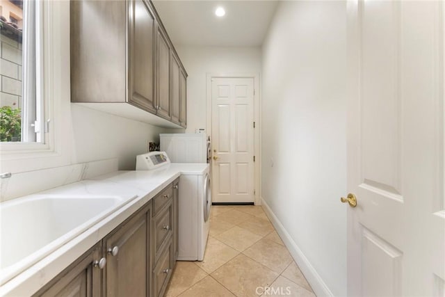 12 Via Avoria, Newport Coast, CA 92657 - washroom featuring cabinet space, light tile patterned floors, separate washer and dryer, recessed lighting, and baseboards