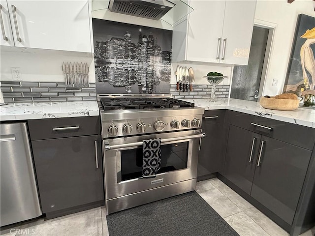 20630 Collegewood Dr, Walnut, CA 91789 - kitchen featuring appliances with stainless steel finishes, tasteful backsplash, light stone countertops, and white cabinets