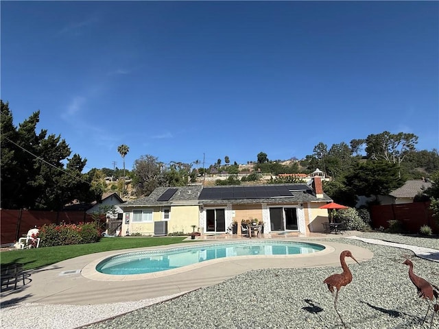 20630 Collegewood Dr, Walnut, CA 91789 - back of property featuring roof mounted solar panels, a patio, and a fenced backyard