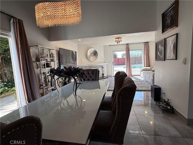 20630 Collegewood Dr, Walnut, CA 91789 - dining space featuring a high ceiling, tile patterned floors, baseboards, and a chandelier