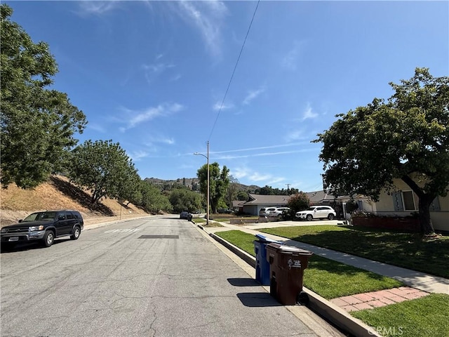 20630 Collegewood Dr, Walnut, CA 91789 - view of asphalt street featuring street lights, curbs, and sidewalks