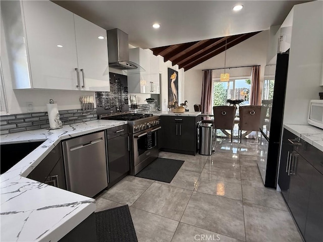 20630 Collegewood Dr, Walnut, CA 91789 - kitchen featuring appliances with stainless steel finishes, wall chimney exhaust hood, vaulted ceiling, tasteful backsplash, and light stone counters