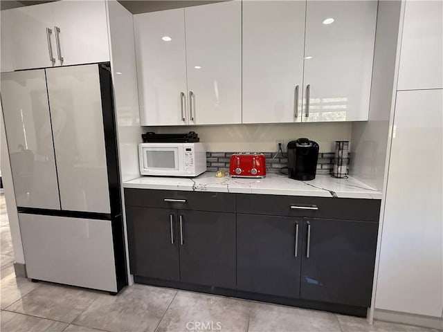20630 Collegewood Dr, Walnut, CA 91789 - kitchen featuring white microwave, freestanding refrigerator, modern cabinets, and white cabinetry