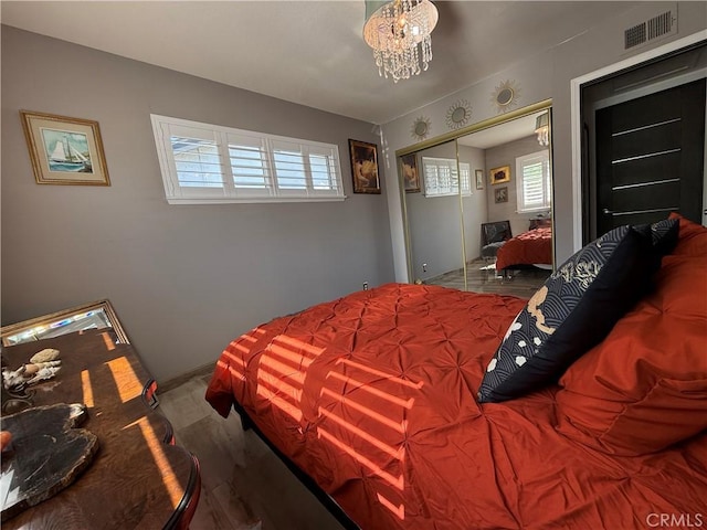 20630 Collegewood Dr, Walnut, CA 91789 - bedroom featuring multiple windows, a chandelier, wood finished floors, and baseboards