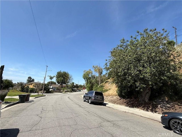 20630 Collegewood Dr, Walnut, CA 91789 - view of asphalt street with curbs, sidewalks, and street lighting