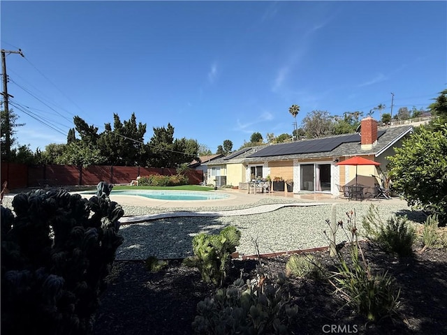 20630 Collegewood Dr, Walnut, CA 91789 - rear view of property with solar panels, a patio, a fenced backyard, and a chimney