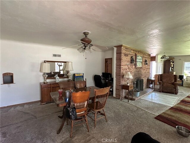 159 S Shasta St S, Willows, CA 95988 - carpeted dining area with ceiling fan and a brick fireplace