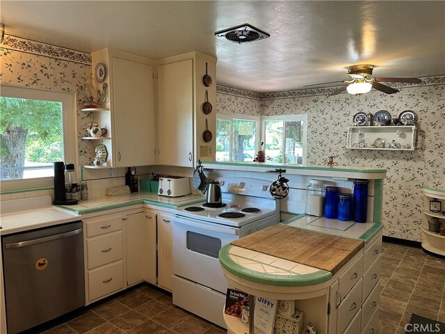 159 S Shasta St S, Willows, CA 95988 - kitchen featuring white range with electric stovetop, open shelves, stainless steel dishwasher, tile countertops, and plenty of natural light