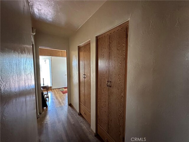 159 S Shasta St S, Willows, CA 95988 - corridor with wood finished floors and a textured wall