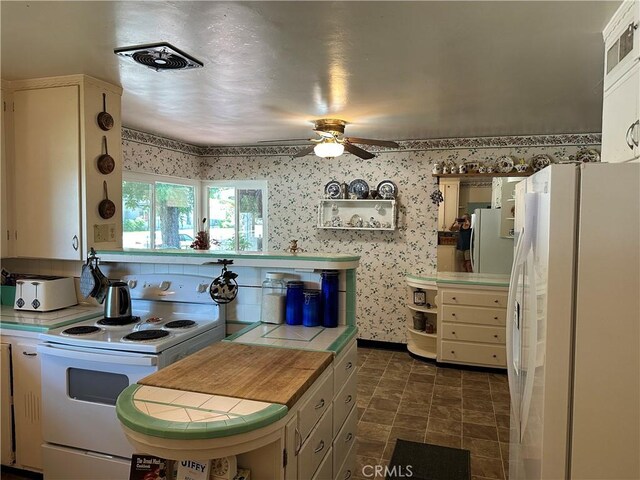 159 S Shasta St S, Willows, CA 95988 - kitchen featuring white appliances, tile countertops, open shelves, a ceiling fan, and wallpapered walls
