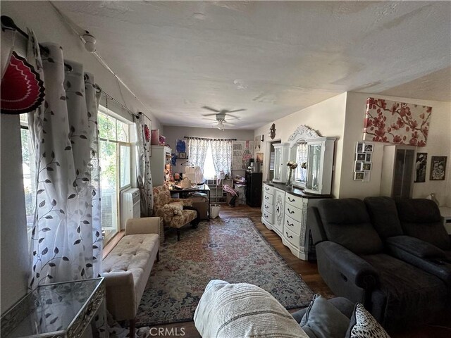 159 S Shasta St S, Willows, CA 95988 - living area featuring wood finished floors, ceiling fan, and cooling unit