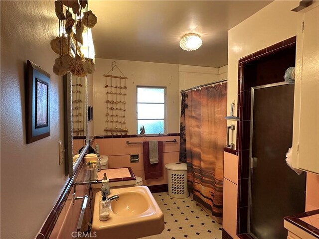 159 S Shasta St S, Willows, CA 95988 - bathroom with a sink, a shower stall, and tile patterned floors