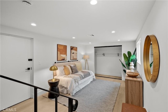 7061 Kester Ave Unit H, Van Nuys, CA 91405 - bedroom with recessed lighting, light wood-style flooring, and a closet