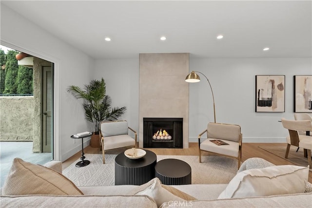 7061 Kester Ave Unit H, Van Nuys, CA 91405 - living area with wood finished floors, recessed lighting, a fireplace, and baseboards