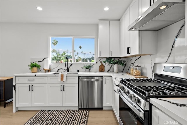 7061 Kester Ave Unit H, Van Nuys, CA 91405 - kitchen featuring stainless steel appliances, ventilation hood, a sink, recessed lighting, and white cabinetry