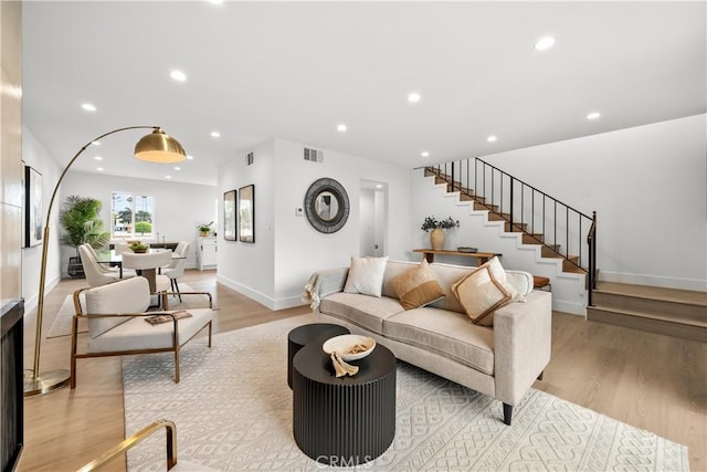 7061 Kester Ave Unit H, Van Nuys, CA 91405 - living area with stairway, light wood-style flooring, recessed lighting, and baseboards
