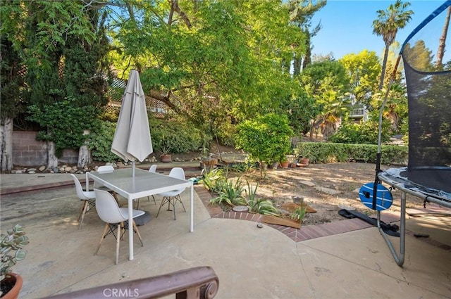 20955 De Mina St, Woodland Hills, CA 91364 - view of patio / terrace featuring a trampoline and outdoor dining space
