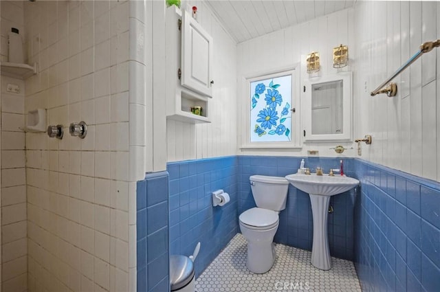 20955 De Mina St, Woodland Hills, CA 91364 - bathroom with toilet, tile walls, tile patterned floors, a wainscoted wall, and wooden ceiling