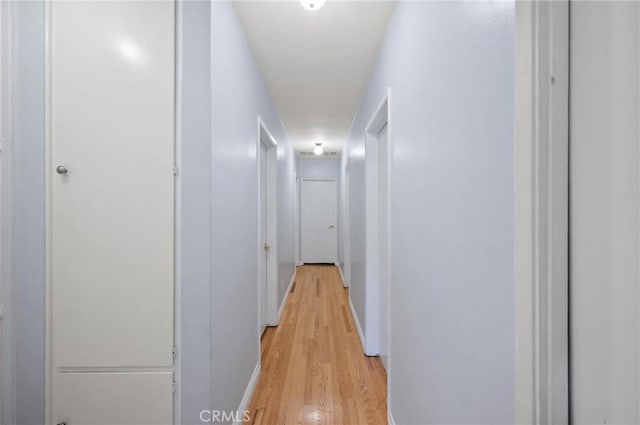 20955 De Mina St, Woodland Hills, CA 91364 - corridor featuring light wood finished floors and baseboards