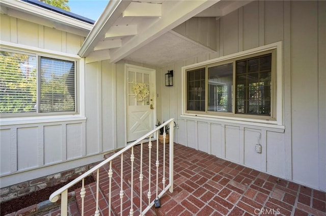 20955 De Mina St, Woodland Hills, CA 91364 - view of exterior entry featuring board and batten siding
