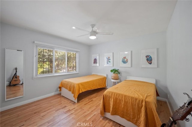 20955 De Mina St, Woodland Hills, CA 91364 - bedroom with light wood finished floors, baseboards, and a ceiling fan