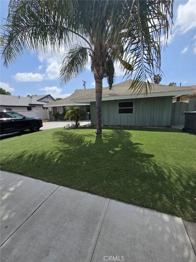 2113 N Lewis St, Santa Ana, CA 92706 - view of home's exterior featuring a yard and board and batten siding